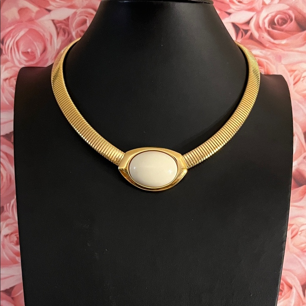 Elegant vintage Trifari gold tone choker with omega chain and cream cabochon